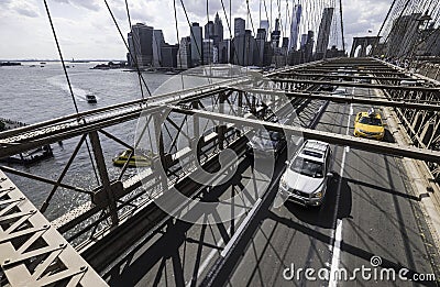 Traffic in sun on Brooklyn Bridge with skyline, Manhattan, New York City Editorial Stock Photo