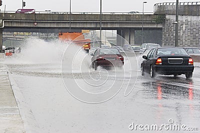 Traffic in Torrential Rain Stock Photo