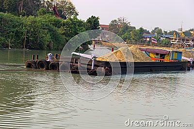 Traffic of vessels and boats on river, extraction of sand Stock Photo