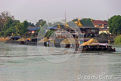 Traffic of vessels and boats on river, extraction of sand Stock Photo