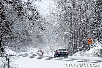 Traffic in winter conditions through the forest Stock Photo