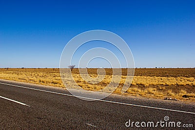 traight road in the dessert of Australia on the Flinders Hightway, Quennsland Australia Stock Photo