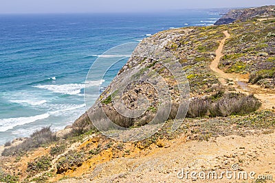 Trail, Cliffs, beach and waves in Arrifana Stock Photo