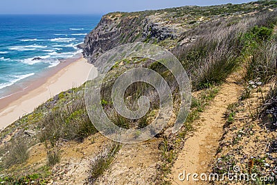 Trail, Cliffs, beach and waves in Arrifana Stock Photo