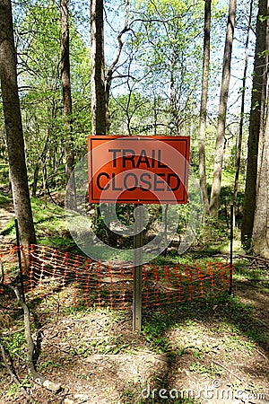 `Trail Closed` Sign in the Middle of the Forest Stock Photo