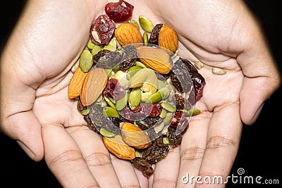 Trail mix on the hand. Stock Photo