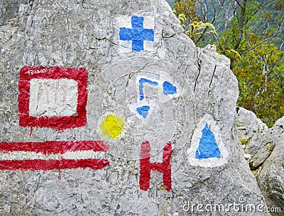 Trailblazing signs on a rock in Cernei Mountains. Stock Photo
