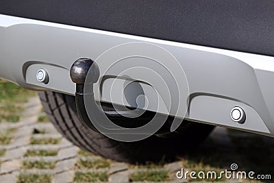 Trailer coupling on a silver-coloured car with reverse warning devices Stock Photo