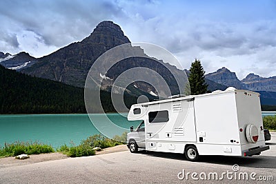 trailer by the lake. trip to the mountains. travel concept. trip by own transport or rented trailer Stock Photo