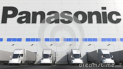 Electric semi-trailer trucks at warehouse loading bay with PANASONIC logo on the wall. Editorial 3D rendering Editorial Stock Photo