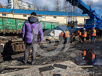 Train accident. Railway workers liquidate the emergency. Editorial Stock Photo