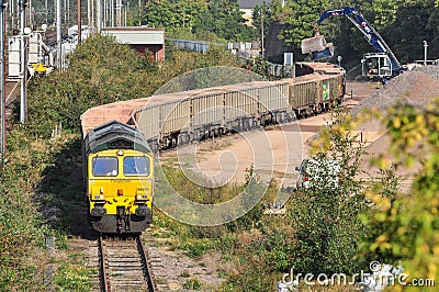 Train of aggregates in Hitchin goods yard Editorial Stock Photo