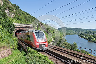 Train along river Moselle in Germany Stock Photo