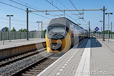 Train arriving at central station Lelystad, the Netherlands Stock Photo