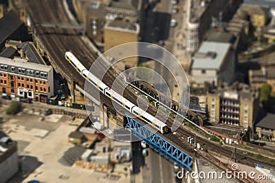 Train on a bridge in London, tilt-shift effect Stock Photo