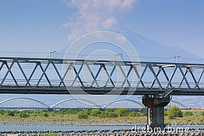 Train bridge and Mount Fuji background. Stock Photo