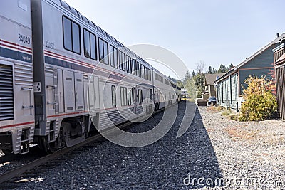 Train cars lined up on the tracks at a rural stop in Truckee California Editorial Stock Photo