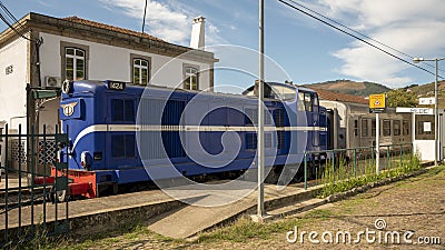 Train coming through the Rede train station along the Linha do Douro train route from Porto Sao Bento to Pocino. Editorial Stock Photo