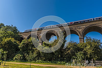 A train crosses a section of the Chappel Viaduct near Colchester, UK Stock Photo