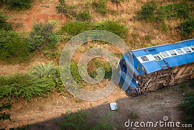 Train derailed and fell off embankment in railway. Stock Photo