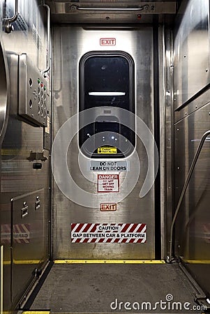 Train door with warning signs Stock Photo