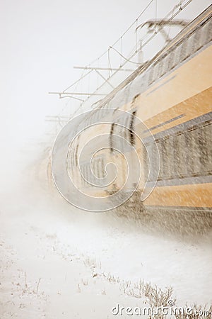 Train driving in severe snowstorm Stock Photo