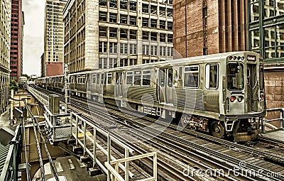 Train on elevated tracks within buildings at the Loop, Chicago City Center - Black Gold Artistic Effect - Chicago, Illinois Stock Photo