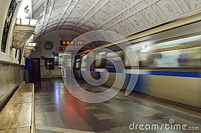 A train going into a subway tunnel is gaining speed. Editorial Stock Photo