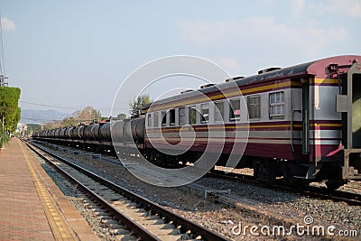 The train head pulling fuel carriage at Nakhon Lampang Railway Station Stock Photo