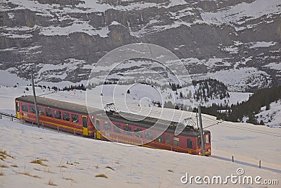 Train of Jungfrau Bahn at Kleine Scheidegg station Editorial Stock Photo