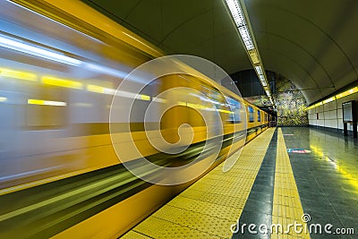 Train leaving subway station Stock Photo