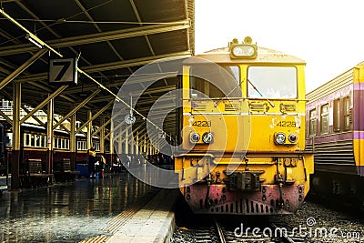 Train led by Old yellow Diesel Electric locomotives. Editorial Stock Photo