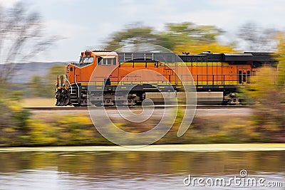 Train Locomotive Speeding Down The Track Stock Photo