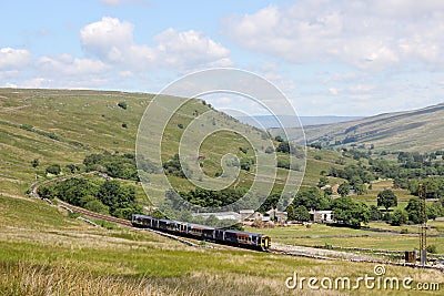 Train in Mallerstang valley on Settle to Carlisle Editorial Stock Photo