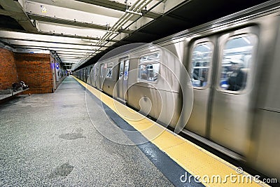 train on New York City subway with homeless sleeping Editorial Stock Photo