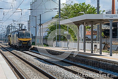 Train passing at Riachos Railway in Torres Novas city Editorial Stock Photo