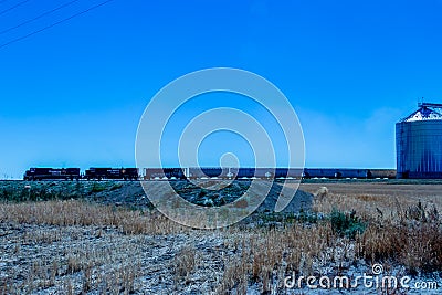 Train picking up grain. Charmangay, Alberta, Canada Stock Photo