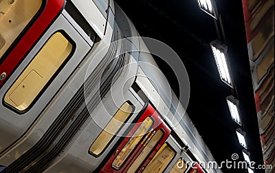 Train on the platform at Euston Square Underground Station, London UK, showing reflection of train on ceiling above. Editorial Stock Photo