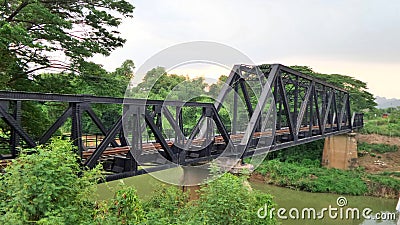 Train pratt truss steel bridge over Pasak river Thailand Stock Photo