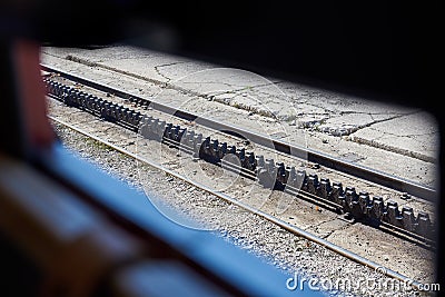 Train rails through the window. Abt rack system. Stock Photo
