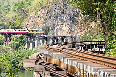 Train running on the death railway at Kanchanaburi, Thailand Editorial Stock Photo