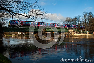 Train running over flooded river Editorial Stock Photo