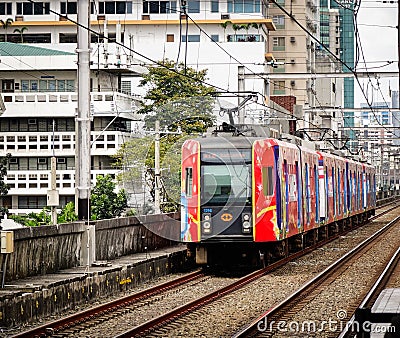 A train running on rail track in Manila, Philippines Editorial Stock Photo