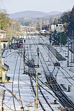 Train station with snow-covered track layout Stock Photo