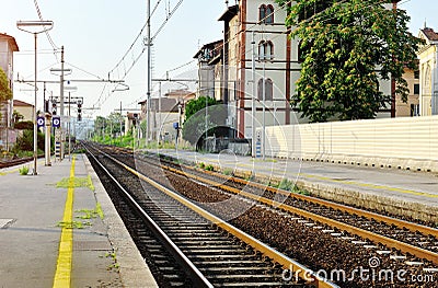 Train station and steel railway tracks, Italy Stock Photo