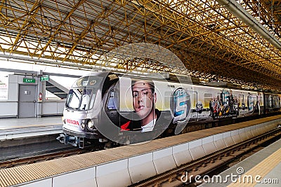 A train stopping at the station in Manila, Philippines Editorial Stock Photo