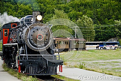 Train and Tour Buses Stock Photo