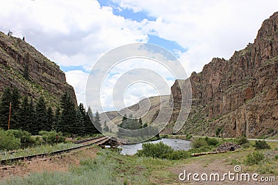 Train tracks running through the mountains Stock Photo