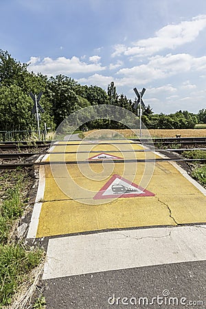 Train warning sign at a railroad crossing Stock Photo