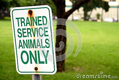 Trained service animals only sign at park in summer Stock Photo